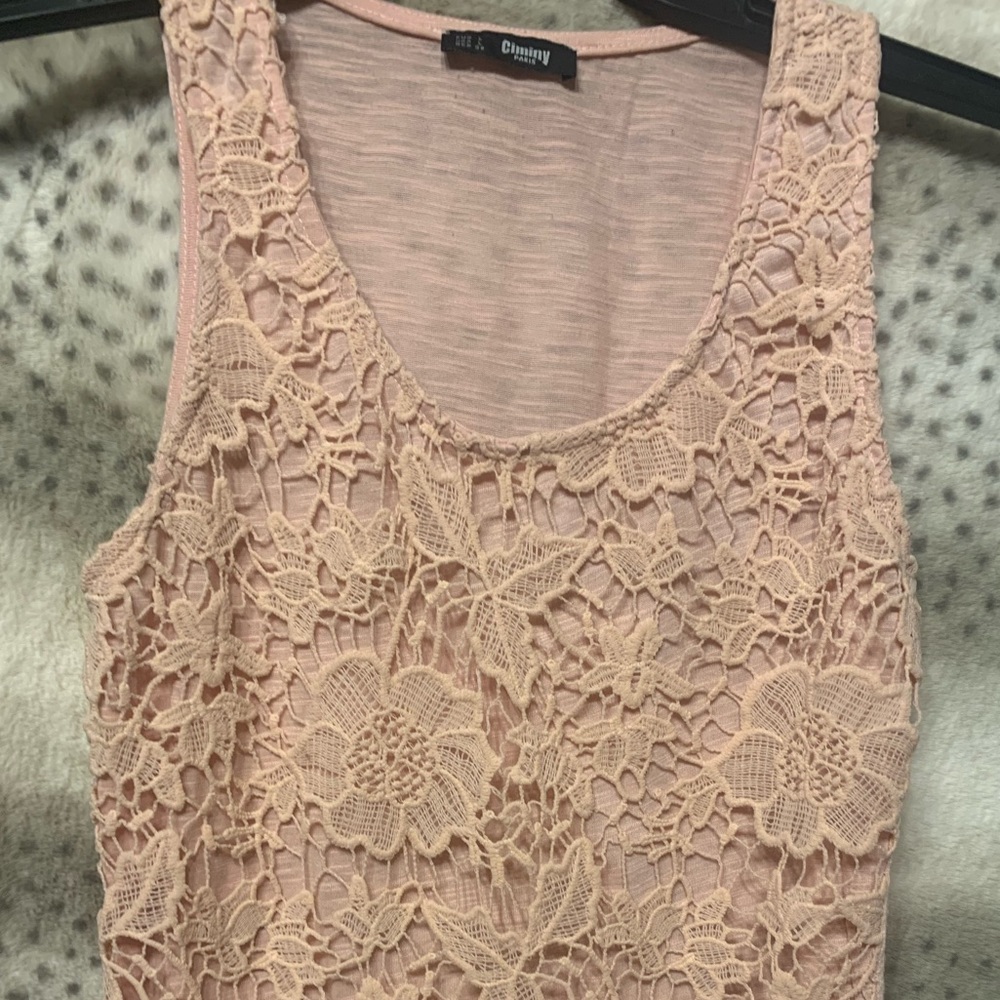 Boutique style tank.  Beautiful light peach in color.